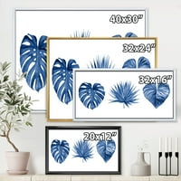 DesignArt 'Тропски лисја во класично сино' тропско врамено платно wallидно печатење